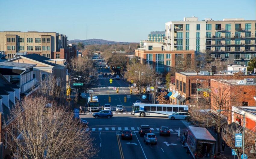 Aerial view of a main road in downtown Chapel Hill with tall buildings on either side