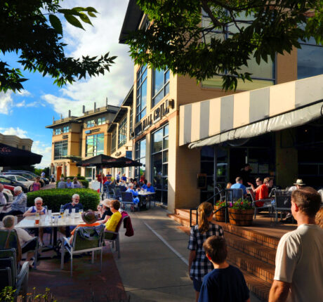People enjoying lunch in a downtown setting sidewalk patio