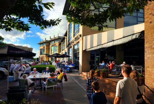 People enjoying lunch in a downtown setting sidewalk patio