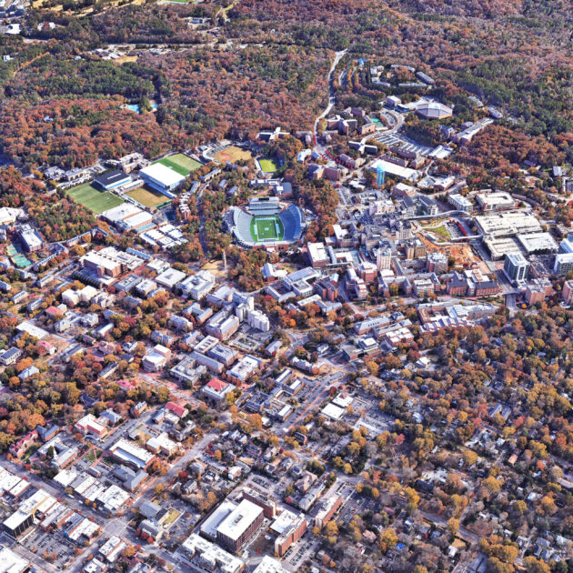 Aerial view of buildings surrounded by forest