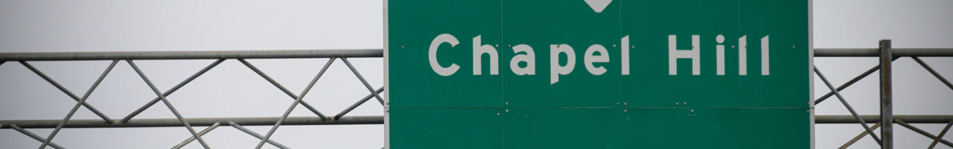 A highway sign leads to the way to Chapel Hill, NC, USA.