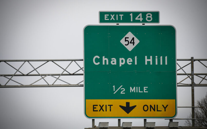 A highway sign leads to the way to Chapel Hill, NC, USA.